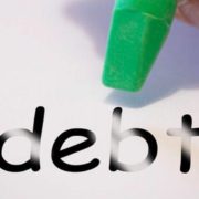 erasing debt with a green eraser